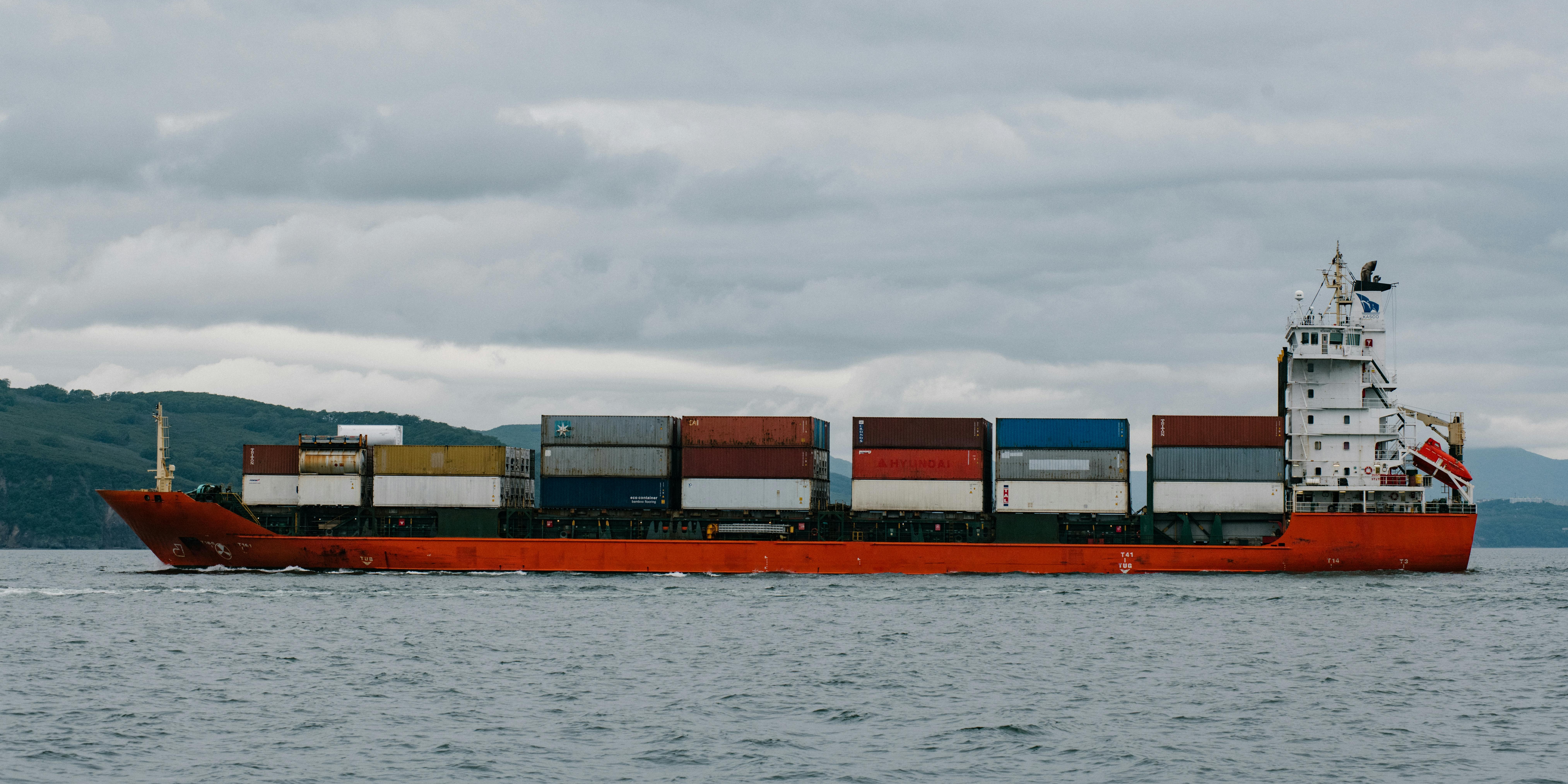 Container ship transporting stacked freight across open water